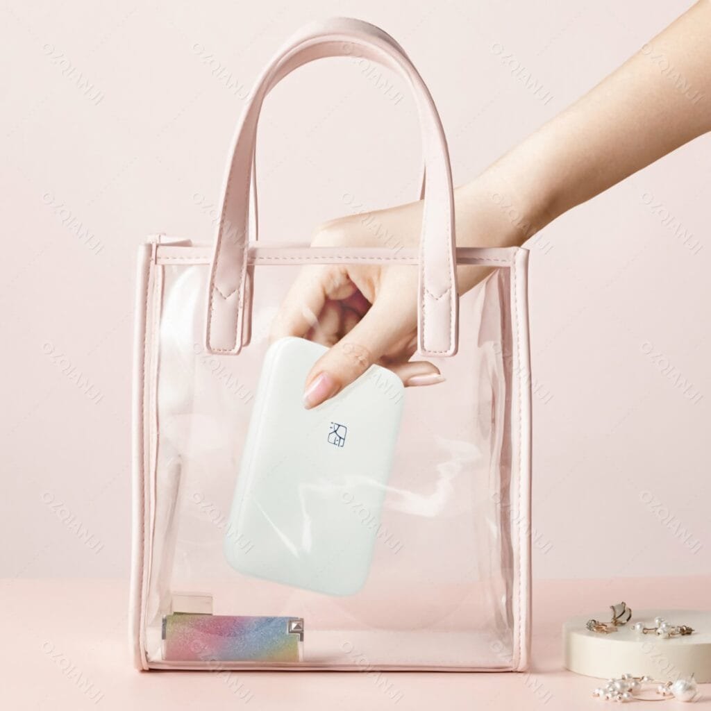 HPRT MT53 Review: Mini photo printer fitting into a small handbag showing high portability