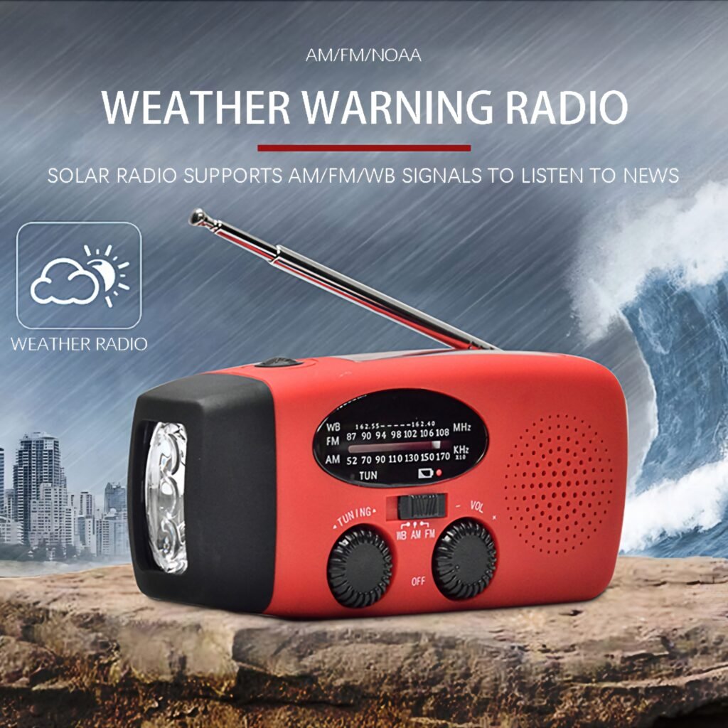 Red weather warning radio with antenna extended sitting near the ocean for emergency alerts