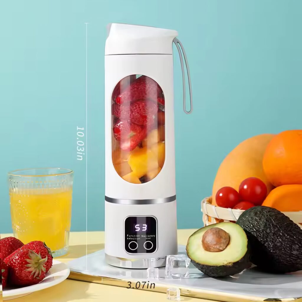 White handheld fruit juicer filled with chopped strawberries and mango ready to blend