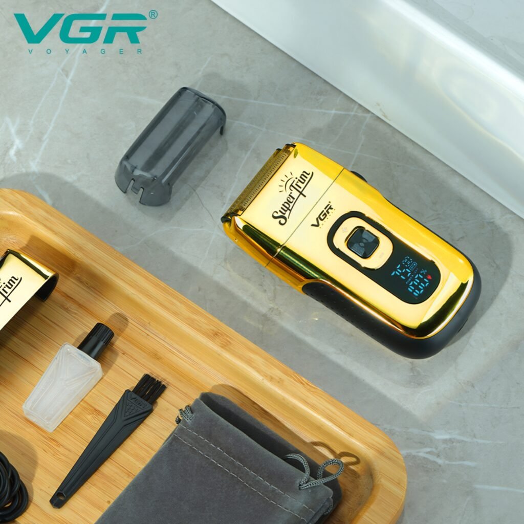 VGR V-332 gold professional shaver with travel pouch and cleaning accessories on a wooden table