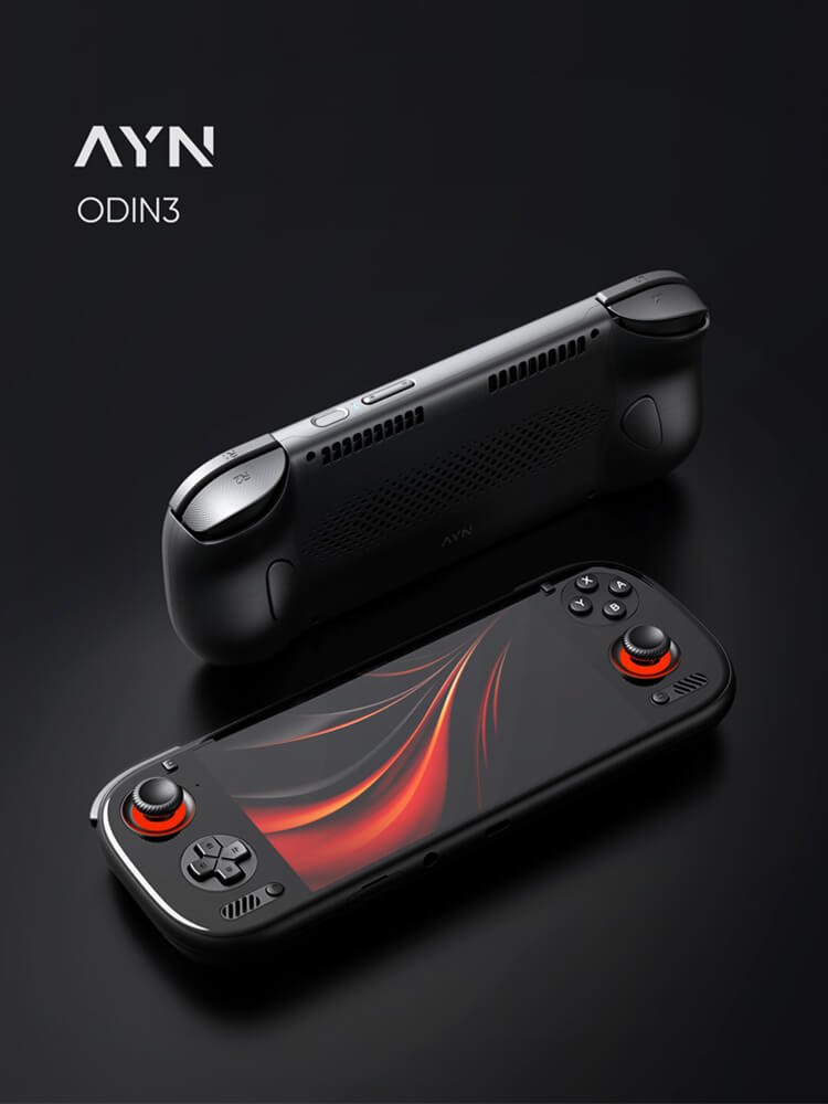 Handheld gaming console on black backgroundProduct render showing two black AYN Odin 3 handheld gaming consoles on a dark background. The front console features orange-rimmed joysticks and a glowing screen, while the second console is positioned behind it to show the back design and top buttons.
