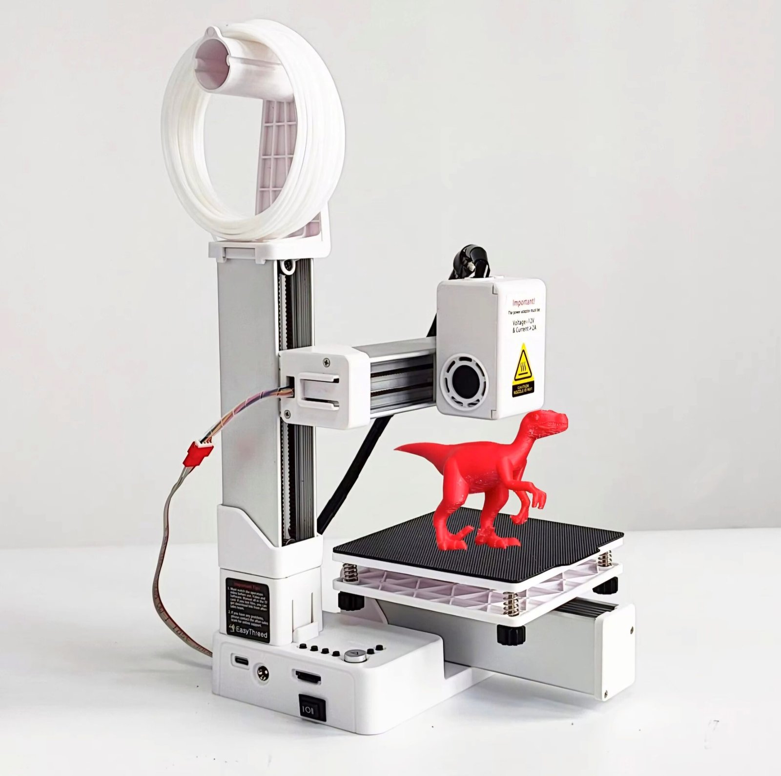 EasyThreed K9 Review - budget 3D printer printing a red toy dinosaur