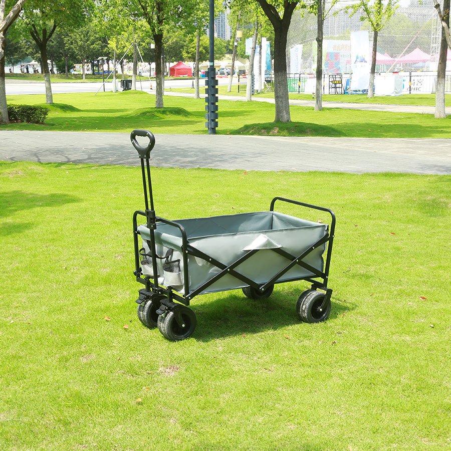 Black folding cart on grass