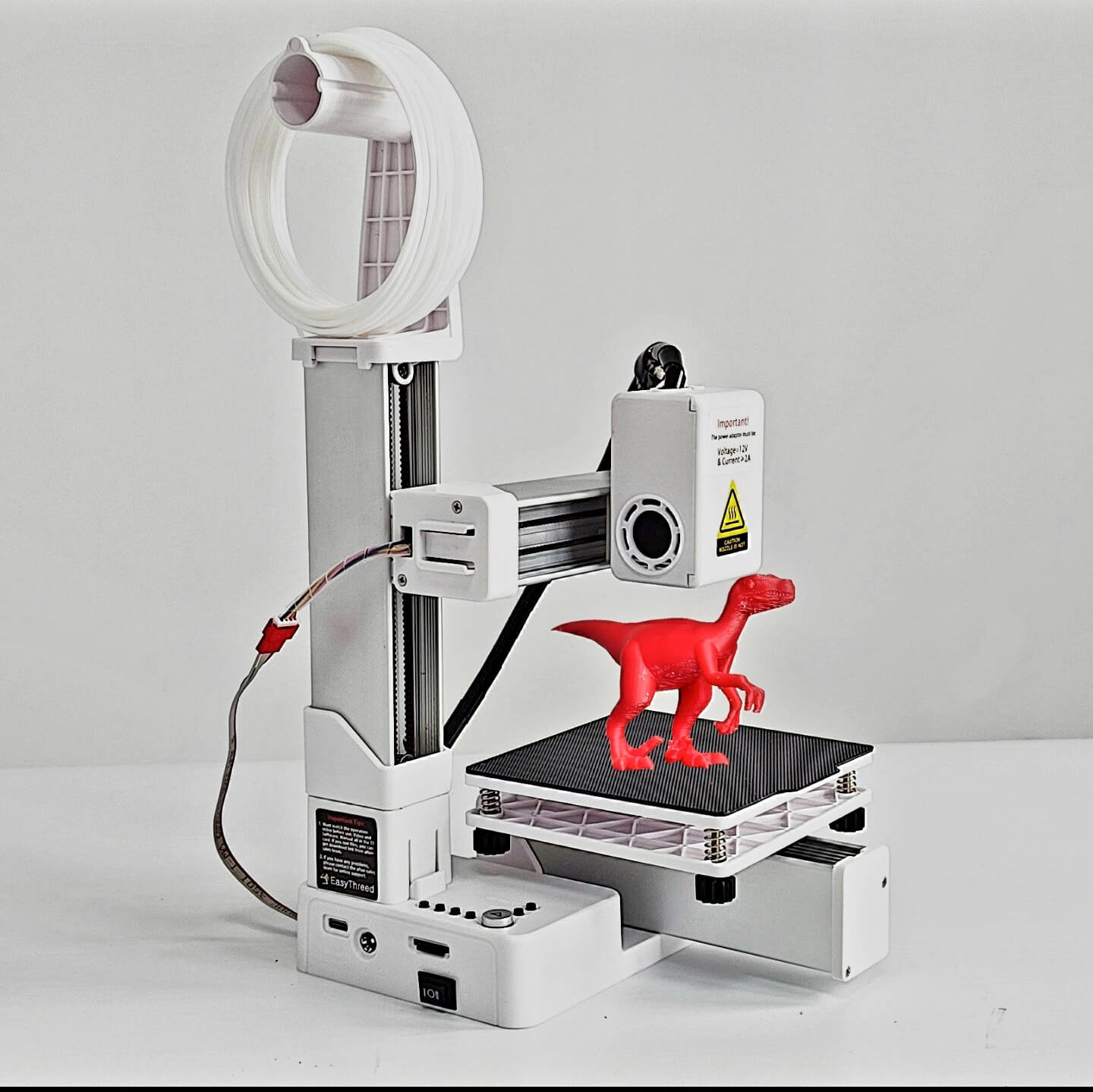 EasyThreed K9 Review - budget 3D printer printing a red toy dinosaur